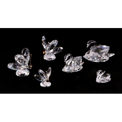 254 - A group of Swarovski crystal figures to include butterflies and swans (7).