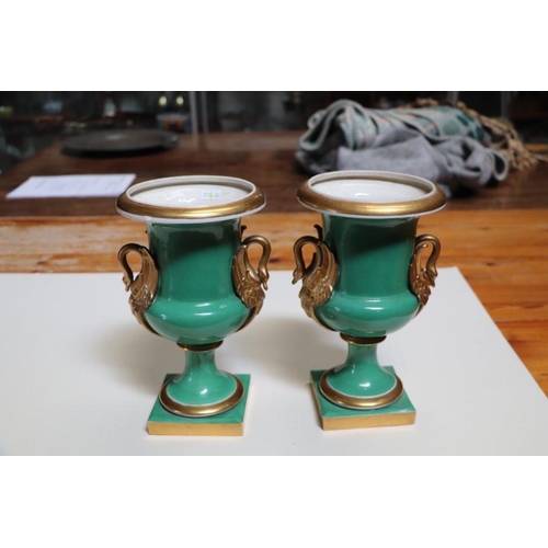 266 - A pair of 19th century continental vases with gilt swan form handles, 25cms high (2).Condition Repor... 