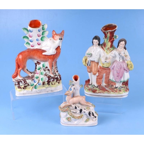 307 - A group of 19th century Staffordshire pottery spill vases to include The Fortune Teller, a zebra and... 