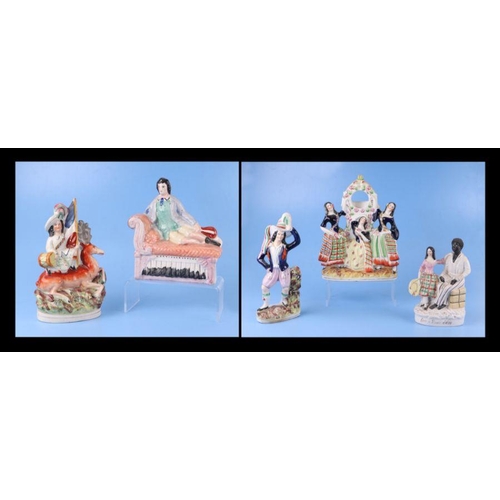 310 - A group of 19th century Staffordshire pottery figures to include Eva and Uncle Tom and a pocket watc... 