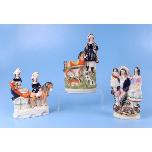 311 - A group of 19th century Staffordshire pottery groups, the largest 26cms high (7).