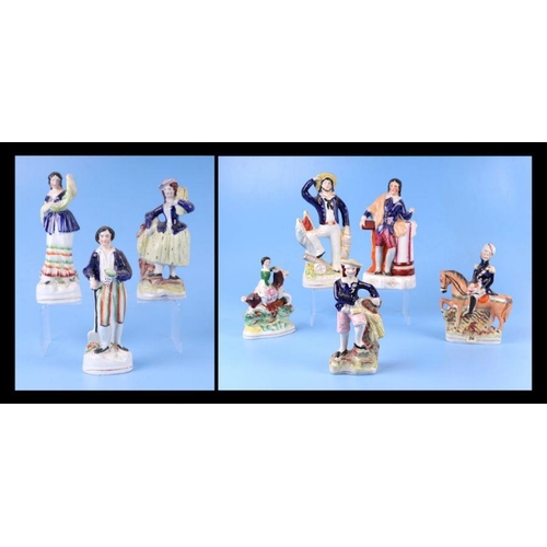 312 - A group of 19th century Staffordshire pottery figures, the largest 24cms high (8).