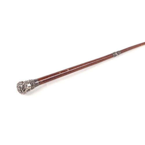 333 - A Victorian ladies leather riding crop / whip with white metal collar and terminal. 72cm long