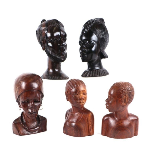 334 - A group of African carved hardwood busts, the largest 22cms high (7).