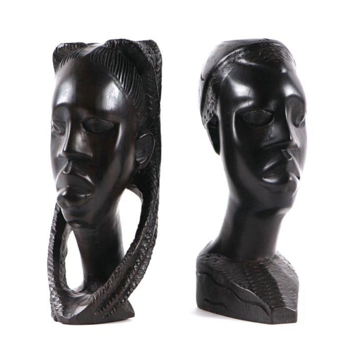 334 - A group of African carved hardwood busts, the largest 22cms high (7).