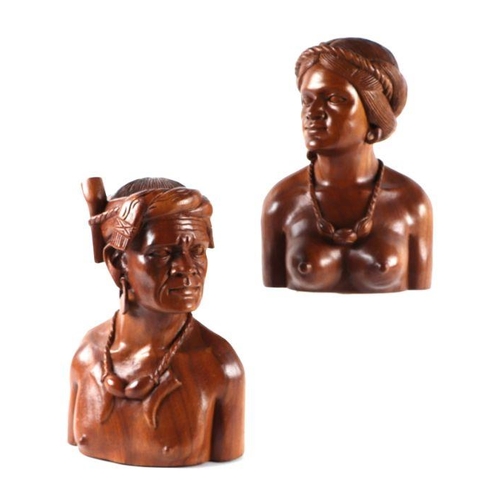 335 - A pair of Burmese carved hardwood busts, 31cms high (2).