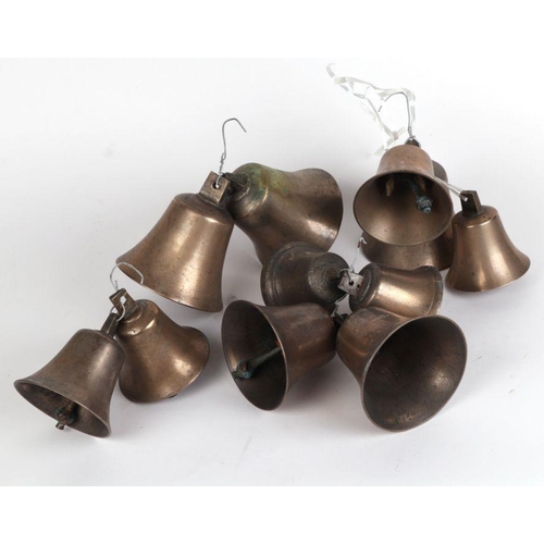 361 - A group of bronze / gun metal graduated bells, the largest 12cms high (11).