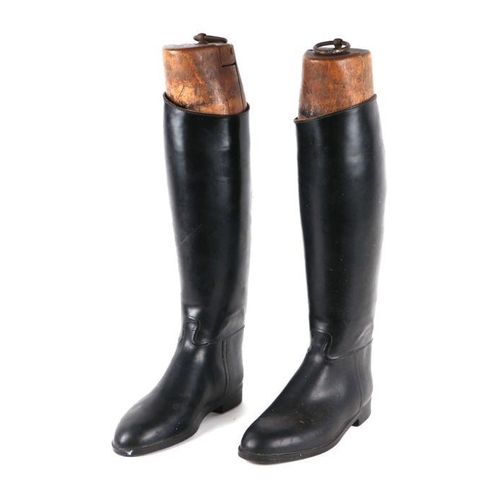 363 - A pair of black leather riding boots with wooden trees.