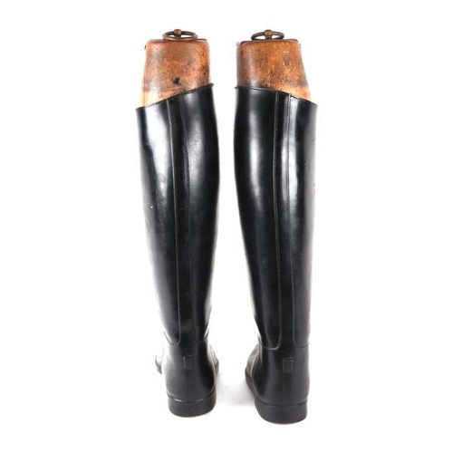 363 - A pair of black leather riding boots with wooden trees.