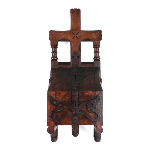 380 - A Gothic Revival oak and wrought iron church collection or money box, 64cms high.