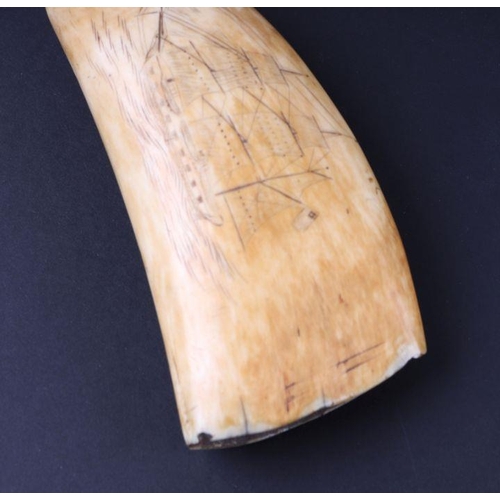 389 - A 19th century whale tooth scrimshaw, one side carved with a ship in full sail, the reverse with a d... 