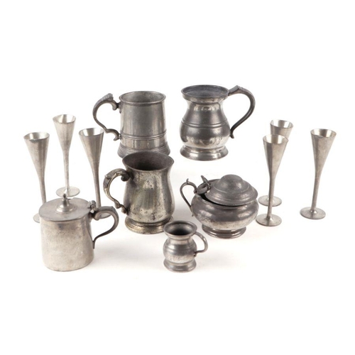 395 - A quantity of pewter ware including a pair of Spanish alter candlesticks, stamped Pedraza Segovia, E... 