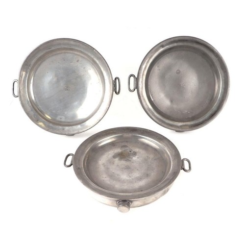 396 - Three early 19th century pewter hot plates, each engraved with an armorial, 26cms diameter (3).