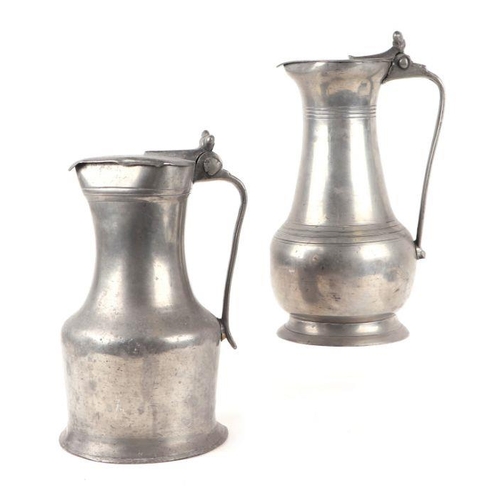 397 - Two early 19th century pewter flagons, one inscribed on the handle 'M Dudouit', 30cms high and 27cms... 