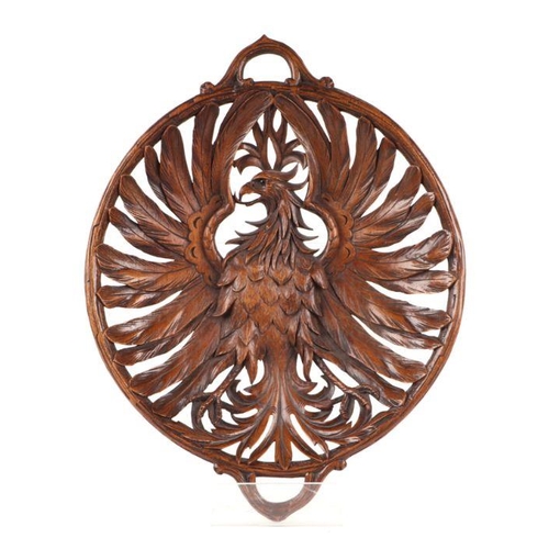 399 - A 19th century carved walnut open work two-handled dish depicting an eagle with outswept wings, 39cm... 