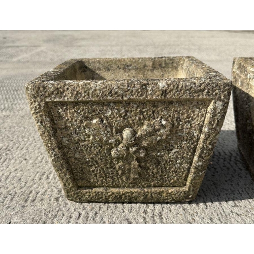 4 - A pair of reconstituted stone planters of square tapering form, 26cms wide.