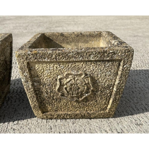 4 - A pair of reconstituted stone planters of square tapering form, 26cms wide.