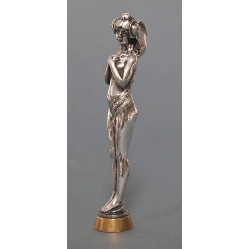 418 - An Art Nouveau silver plated figural desk seal in the form of a fairy with monogramed matrix, 13cm h... 