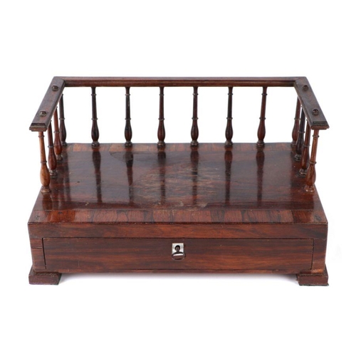 421 - A 19th century rosewood desk stand, the rectangular crossbanded top with three-quarter gallery above... 