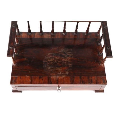 421 - A 19th century rosewood desk stand, the rectangular crossbanded top with three-quarter gallery above... 