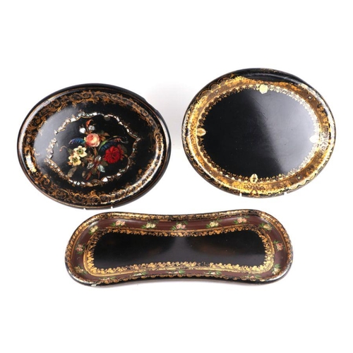 425 - Two Victorian papier-mâché oval trays, each 45cms wide; together with a similar shaped tray, 57cms w... 