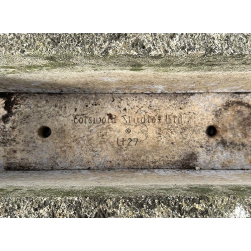 5 - A reconstituted stone rectangular planter, 61cms wide.