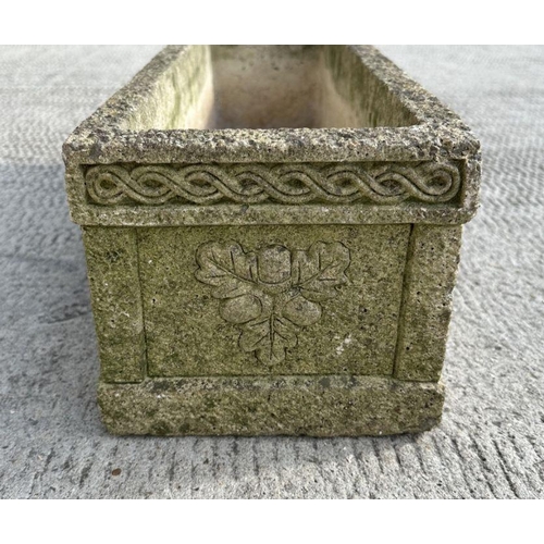 5 - A reconstituted stone rectangular planter, 61cms wide.