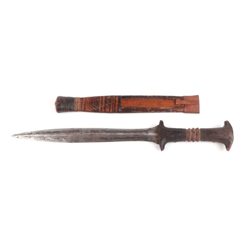 55 - A North African dagger with hardwood handle and leather sheath.