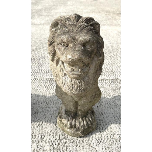 6 - A group of three well weathered stone figures of seated lions, each 44cms high (3).