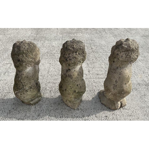 6 - A group of three well weathered stone figures of seated lions, each 44cms high (3).