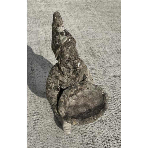 7 - A weathered concrete figure of a gnome riding a motorcycle,58cms high; together with a similar figur... 