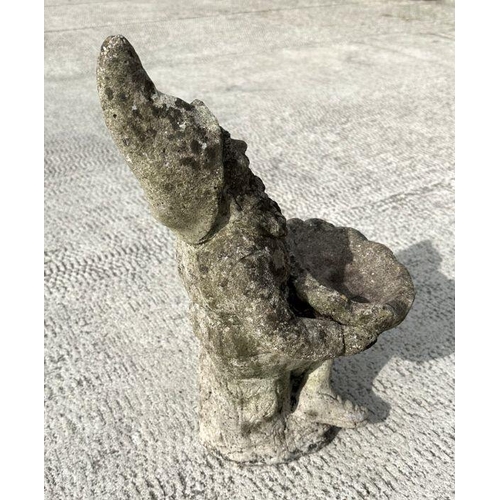 7 - A weathered concrete figure of a gnome riding a motorcycle,58cms high; together with a similar figur... 