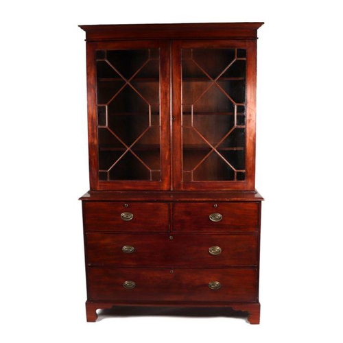 864 - A 19th century mahogany bookcase on chest, the pair of astragal glazed doors enclosing a shelved int... 