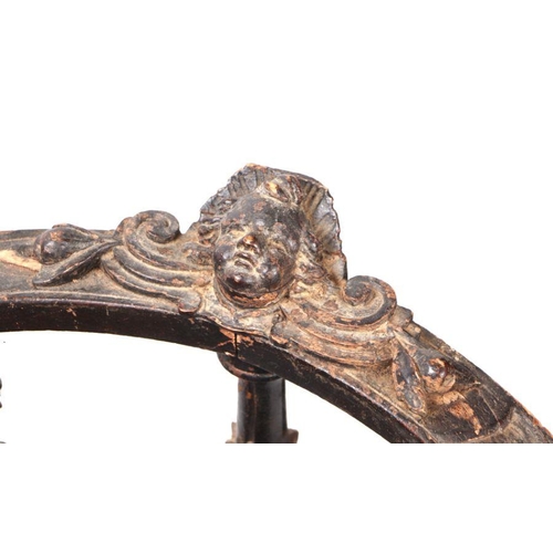 899 - An early 19th century continental oak window seat with cherub head and griffin carvings and dragon h... 