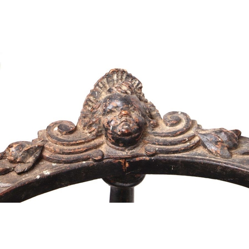 899 - An early 19th century continental oak window seat with cherub head and griffin carvings and dragon h... 