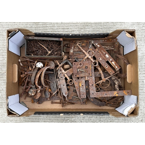 386 - Assorted door furniture and ironwork including Suffolk latches, Heaven & Hell hinges, lock plates, h... 