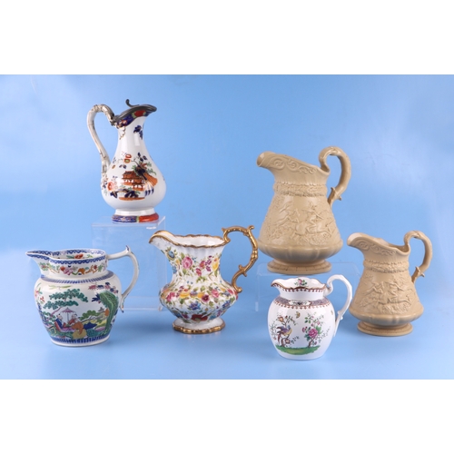 295 - A collection of Victorian and later jugs to include Ridgeway and Masons.