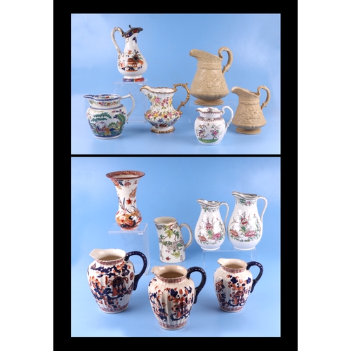 295 - A collection of Victorian and later jugs to include Ridgeway and Masons.