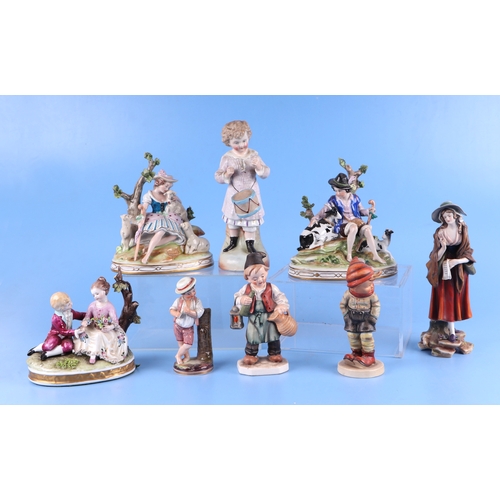 300 - A group of porcelain figures to include Royal Doulton Rose HN1368; a Meissen style bird, Goebel and ... 