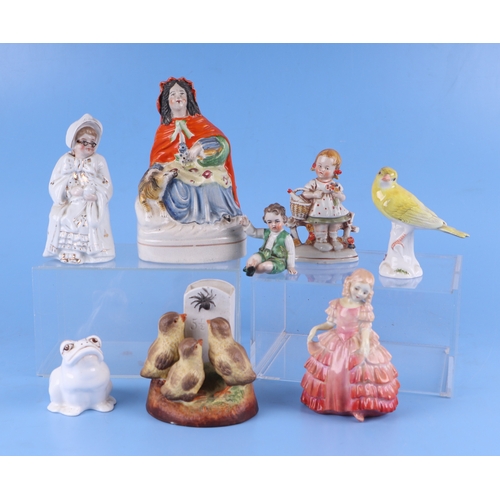 300 - A group of porcelain figures to include Royal Doulton Rose HN1368; a Meissen style bird, Goebel and ... 