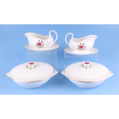 302 - A large quantity of Royal Doulton Sweetheart Rose pattern tea and dinner wares.