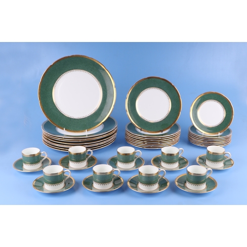 305 - A Coalport part dinner, coffee and tea set decorated with a green band with gilt highlights.