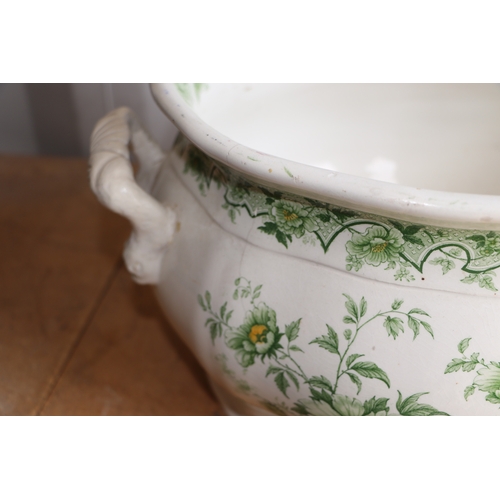 292 - A Victorian green & white footbath and water jug decorated with flowers, the footbath 47cms wide, th... 