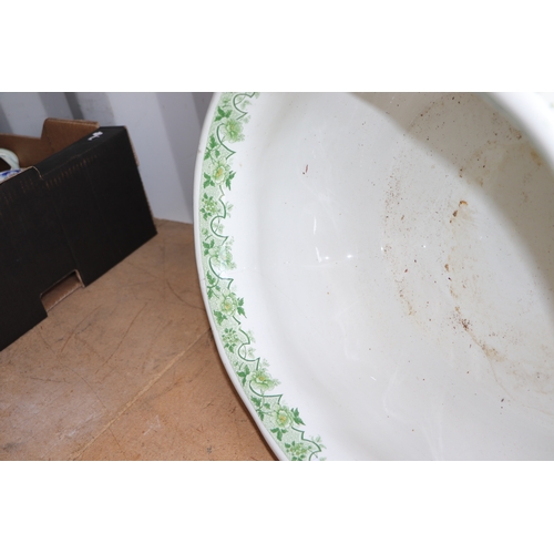 292 - A Victorian green & white footbath and water jug decorated with flowers, the footbath 47cms wide, th... 