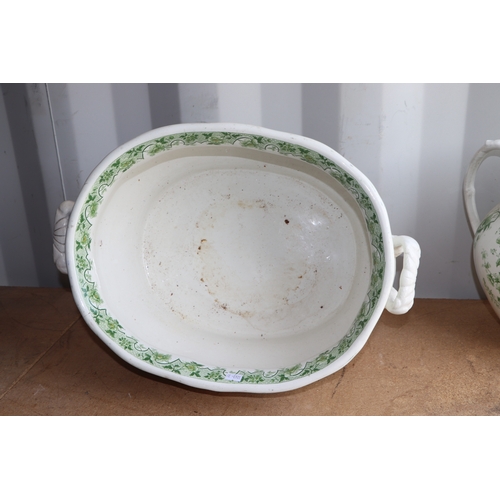 292 - A Victorian green & white footbath and water jug decorated with flowers, the footbath 47cms wide, th... 