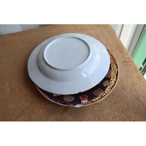 284 - A quantity of early 19th century Imari pattern ceramics to include plates and tea wares.