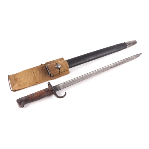 105 - A Loyal Regiment (North Lancashire) 1907 pattern bayonet with hooked quillion, leather scabbard and ... 