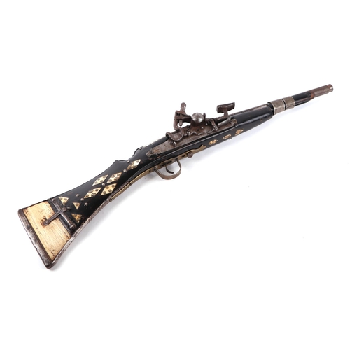 109 - An Afghan Miquelet musket with steel barrel, 73cms long.