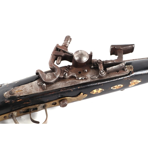 109 - An Afghan Miquelet musket with steel barrel, 73cms long.