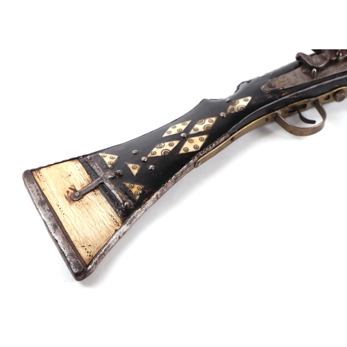 109 - An Afghan Miquelet musket with steel barrel, 73cms long.